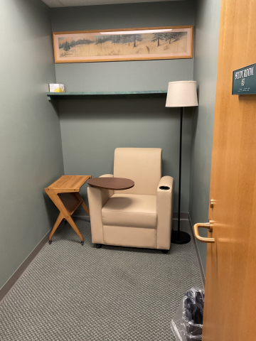 Study Room 3 includes a single tablet arm chair, end table and floor lamp.